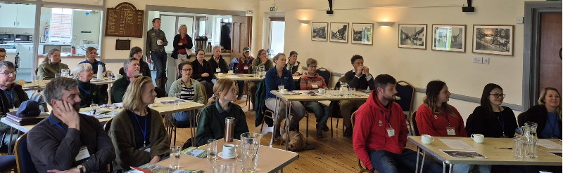 Participants listening to a training presentation