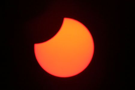 Partial solar eclipse by Mike Peel C/O Wikimedia Commons